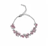 Pulsera con colgante ovalado de circón rosa fresco con un diseño único, personalidad de nicho, lujo ligero y sensación de alta gama