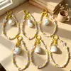 Colgante de pato de moda con lazo, cuentas de queso, llavero, correa para teléfono, accesorio para bolso, accesorio de bricolaje, regalo