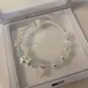 Diseño original ópalo natural cristal de fresa pulsera de la suerte simple lujo ligero diseño de nicho hilo elástico