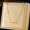 Nuevo de Moda Europeo y Americano Más Vendido Largo Incrustado de Diamantes Acero Inoxidable Chapado en Oro Versátil Conjunto de Collar Pulsera Pendientes para Mujeres