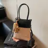 Bolso de Mano de Cuero Genuino Esmerilado de Diseño de Nicho 2026 Nuevo Bolso para Teléfono de Moda Bolso Cubo de Gama Alta Bolso de Hombro Único Bolso Cruzado