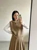 Otoño temprano 2026 nuevo suéter chaleco de punto sin mangas de moda con estilo, cárdigan con capucha para mujer