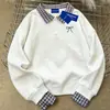 Moletom Criativo com Estampa de Laço Estilo Coreano Estilo Universitário Gola Polo para Mulheres Outono e Inverno 2025 Versátil Top Falso de Duas Peças