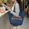 Bolsa de Lona Estampada Versátil com Letras Coreanas Verão 2025 Design de Nicho Grande Capacidade Bolsa Tote de Ombro para o Dia a Dia