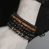 Pulsera tejida de cuentas de madera vintage transfronteriza, cáscara de coco con cordón de cuero, cierre magnético, accesorio metálico para la mano, pulsera para hombre hip-hop punk