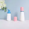 En stock botella cónica blanca de espuma de 60 ml, botella espumadora de PET para mousse de 100 ml, dispensador portátil de espuma facial