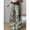 Jeans rotos de patchwork bicolor con estampado de leopardo para hombre y mujer, pantalones estilo vintage hiphop wasteland, pantalones anchos de alta calle americanos