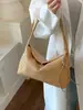 Bolsa de nicho transfronteiriça estilo francês feita à mão para mulheres, nova bolsa de ombro versátil casual 2026, bolsa tote simples para o dia a dia