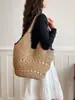 Bolsa de playa tejida casual de verano para mujer, bolsa de hombro versátil para el día a día estilo Hepburn de alta gama