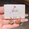 Aretes de piedra ojo de tigre y perla en dos tonos, chapados en oro de 18 quilates, aretes populares de estilo chino nuevo de lujo ligero para mujer