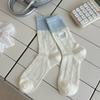 Calcetines de tubo suxinaimin primavera y verano blanco lechoso azul calcetines de tubo ins letras bordadas calcetines de felpa a rayas moda