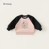 Frete Grátis Roupa Infantil Moletom Feminino Coleção Outono 2026 Estampa Graffiti Infantil Versátil Gola Redonda Manga Raglan Top para Criança Pequena