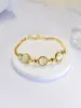 Pulsera de Piedra Ojo de Gato Chapada en Oro Real, Sensación de Lujo Ligero de Alta Gama, Joyería Redonda de Aleación, Venta al por Mayor para Mujeres