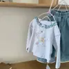 Camiseta Infantil Estilo Coreano Estampa Fofa de Ursinho Desenho Animado Manga Longa T2026 Nova Roupa Base Estilosa para Primavera e Outono para Crianças e Bebês
