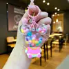 Llavero acrílico con forma de botella de arenas movedizas en aceite, regalo al por mayor, colgante de muñeca de donut, lindo llavero de arenas movedizas.