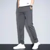 Calça Masculina Casual Slim Fit com Stretch Nova para Primavera e Verão 2026 Calças Masculinas de Verão Moda Versátil Tendência