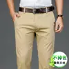 Calças casuais de alta qualidade em Tencel stretch para homens, novo estilo de outono, calças de moda versáteis de perna reta soltas para negócios