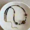 Colgante de Piedra Ojo de Tigre Estilo Étnico Vintage Collar Pequeño de Flores con Cuentas para Mujeres Personalidad Artística Tendencia de Moda Gargantilla Cadena para Suéter