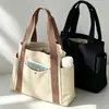 Bolsa de lona transfronteiriça, bolsa de ombro versátil, grande capacidade para carregar livros, bolsa para o dia a dia do estudante, bolsa de mão com logotipo estampado