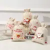 Bolsa de regalo de algodón con estampado navideño y cordón, linda bolsa de embalaje de Papá Noel, bolsa de tela para recuerdos