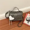 Bolso pequeño cuadrado tipo caja INS estilo coreano para mujer, bandolera individual, bolso de mano de lunares elegante popular este año, bolso tote pequeño, transfronterizo
