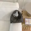 Bolsa de Mano Pequeña Texturizada de Nicho al por Mayor Transfronteriza para Mujer 2026 Nueva Bolso Cubo Simple Versátil Bolso de Hombro Cruzado