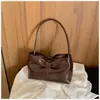 Bolso de mano de comercio exterior transfronterizo de la fábrica de origen, diseñado con un lazo, estilo de lujo ligero y simple, bolso de axila para mujer