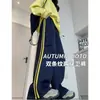 Pantalones Deportivos Rayados Americanos para Mujer Primavera y Otoño Nuevos Sueltos Adelgazantes Rectos Diseño Casual Sentido Ropa de Trabajo Pantalones de Pierna Ancha
