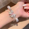 Pulsera de perlas con lazo de doble capa estilo vintage francés, diseño único y versátil, joyería de lujo ligero y de alta gama