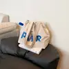 Bolsa de Lona Estilo Coreano 2026 con Letras e Impresión Ins, Bolso de Hombro para Viajes Diarios con Cordón, Gran Capacidad, en Color Beige y Café