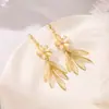 Aretes Colgantes Largos con Borla de Flor Pequeña de Piedra Ojo de Gato para Mujer Diseño con Sentido Popular en Internet Aretes Versátiles Nuevos Aretes de Moda