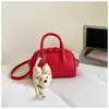 Bolso de boliche rosa claro estilo dulce para mujer, nuevo bolso de mano texturizado de nicho de verano 2026, bolso de cadena para el trabajo