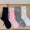 Meias de cano médio para primavera e verão com laços de fita, design vazado, estilo Lolita ballet, meias folgadas estilo ins feminino para mulheres