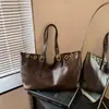 Bolsa casual retro esmerilada para mujer 2026 nuevo modelo de gran capacidad para el día a día, bolso de hombro, bolso de mano simple de moda, bolso tote