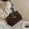 Nuevo modelo Otoño 2026, lujo ligero, elegante, bolso de mano para uso diario, bolso tipo Kelly para mujer de oficina, bolso de hombro