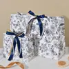 Sacolas de presente transfronteiriças com estampas florais e fitas, sacolas de embalagem de alta qualidade, sacolas de presente para feriados, bolsas de mão, sacolas de embalagem para roupas