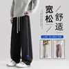 Pantalones de chándal casuales, cómodos, holgados para hombre, talla grande, diseño moderno y a la moda, pantalones rectos versátiles, pantalones largos sencillos y fluidos