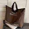 Bolsa de grande capacidade para mulheres primavera/verão versátil 2023 nova bolsa de mensageiro de lona texturizada bolsa de viagem portátil bolsa de balde