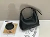 Bolso de mano de moda estilo coreano tipo bolsa de dumplings con textura de cuero genuino, bolso de hombro versátil con diseño único para mujer