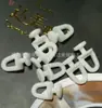 Fabricantes fornecem acessórios para cortinas trilho polia varão romano sub-roda de cortina roda italiana central roda de trilho quadrado reto atacado