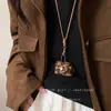 Pequeno e bonito porta-moedas de couro colar pingente feminino fone de ouvido estojo corda de couro corrente de lã acessórios longos bolsa de armazenamento