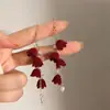 Pendientes de Borlas con Lazo Rojo 2026 Nuevo Estilo Caliente Lujo Ligero Gama Alta Pendientes de Año Nuevo Accesorios de Oreja Únicos de Nicho