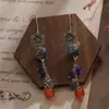 Pendientes Largos Personalizados de la Fábrica Jinqi Estilo Chino Nuevo Flor Pequeña Hueco Azul Quemado Borla para Mujer Pendientes Estilo Étnico Vintage