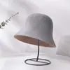 Sombrero de pescador de cubo estilo japonés y coreano para primavera y otoño, sombrero de pescador femenino, color sólido, todo a juego, sombrero tipo cubeta, circunferencia de cabeza grande, adelgazamiento facial, pequeño, moda, venta al por mayor