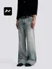 Jeans estiloso retro azul lavado para homens e mulheres, corte solto, estilo de rua, com efeito desgastado e esbranquiçado, perna reta, calça casual de perna larga
