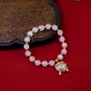 Novo Bracelete de Pedra Olho de Gato Estilo Chinês com Pingente de Sino, Bracelete Redondo de Contas de Círculo Único Feito à Mão, Joia Unissex
