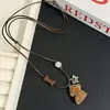 Collar con Colgante de Perro Oso Flocado Lindo para Mujer Cadena de Suéter Cadena de Sudadera de Madera con Forma de Pez y Campana Dulce Fresca Larga Moda