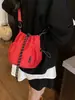 Bolso bandolera de hombro único de estilo coreano para comercio exterior, bolso de cubo fresco con cordón para mujer, bolso de hombro pequeño casual de nailon texturizado transfronterizo