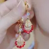 Pendientes de Borla con Forma de Gota de Agua y Pétalo Completamente Incrustados en Diamantes, Estilo Moda de la Industria Pesada Europea y Americana, Pendientes Calientes Festivos Otoño e Invierno Rojo Ankora