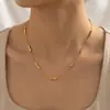 Collar minimalista de moda transfronterizo, cara sonriente chapada en oro, versátil para el uso diario y como regalo, con un pequeño colgante de ladrillo de oro en forma de lágrima